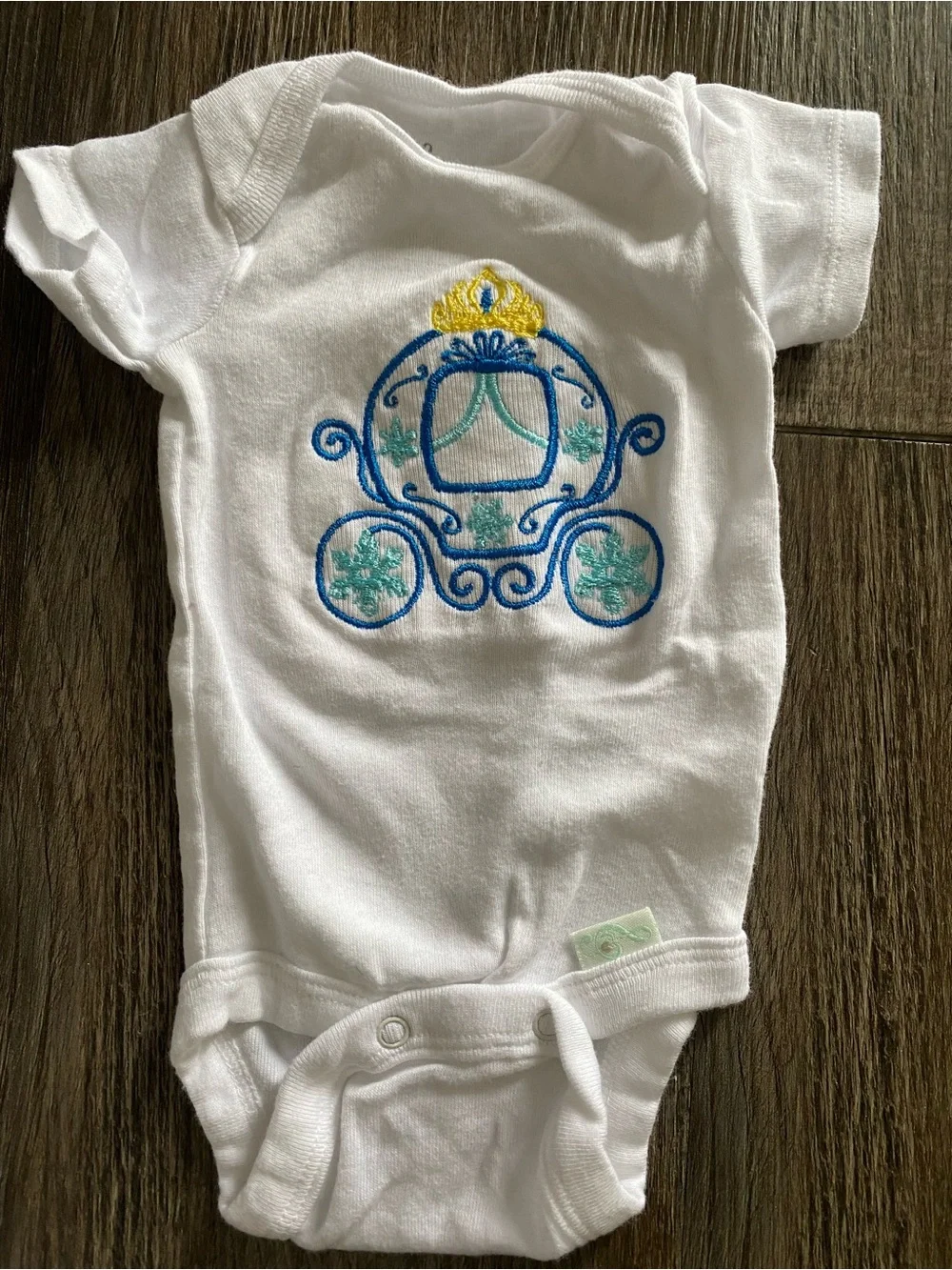 Home embroidered baby bodysuits